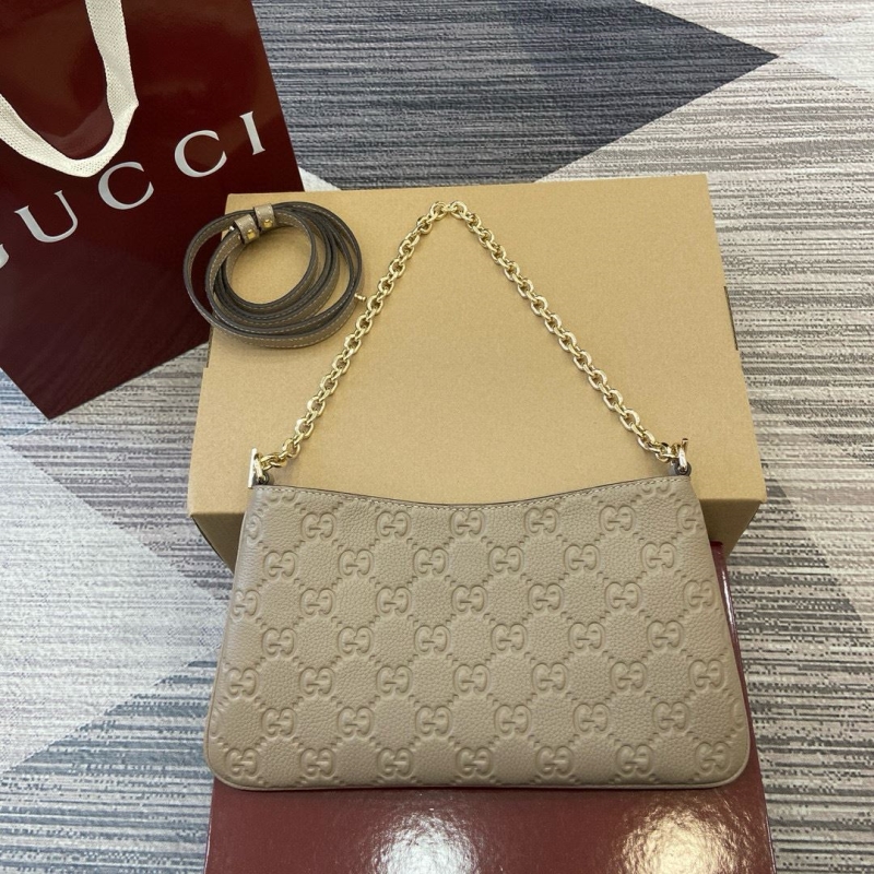 G*u*i top handle bags